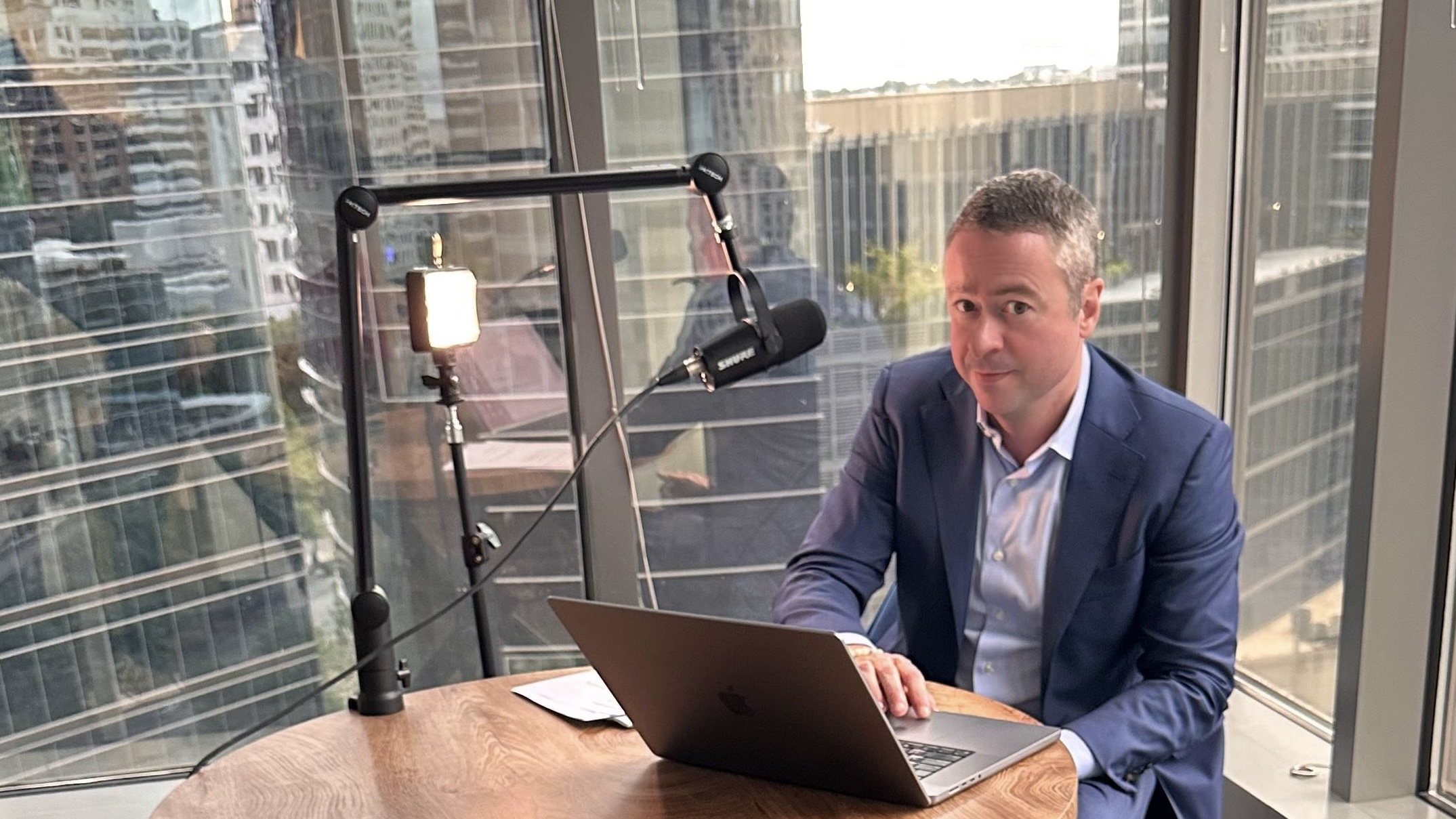 Shaun Southworth seated at a desk recording Civil Rights for Civil Servants